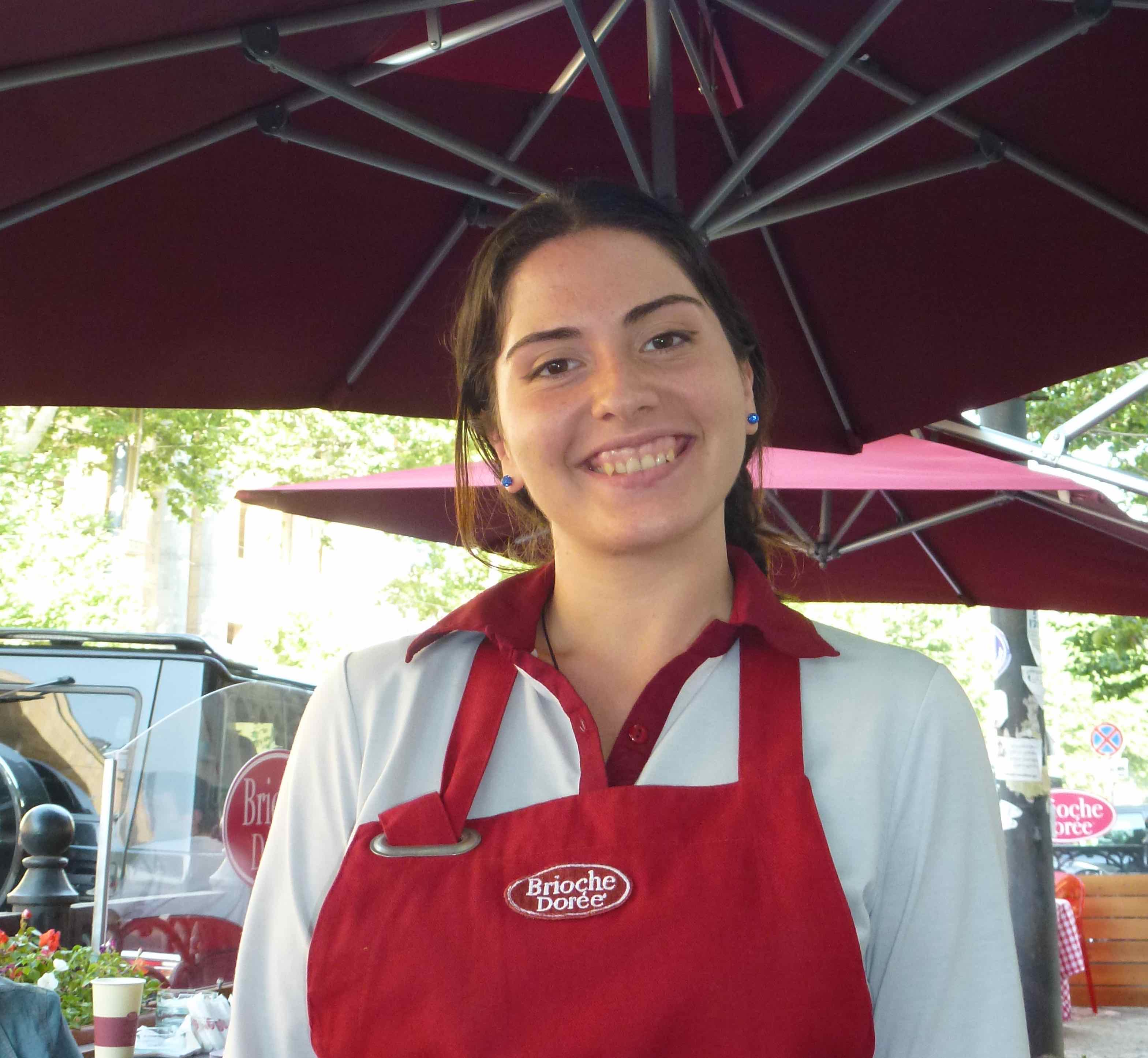 Image of waitress at outdoor cafe