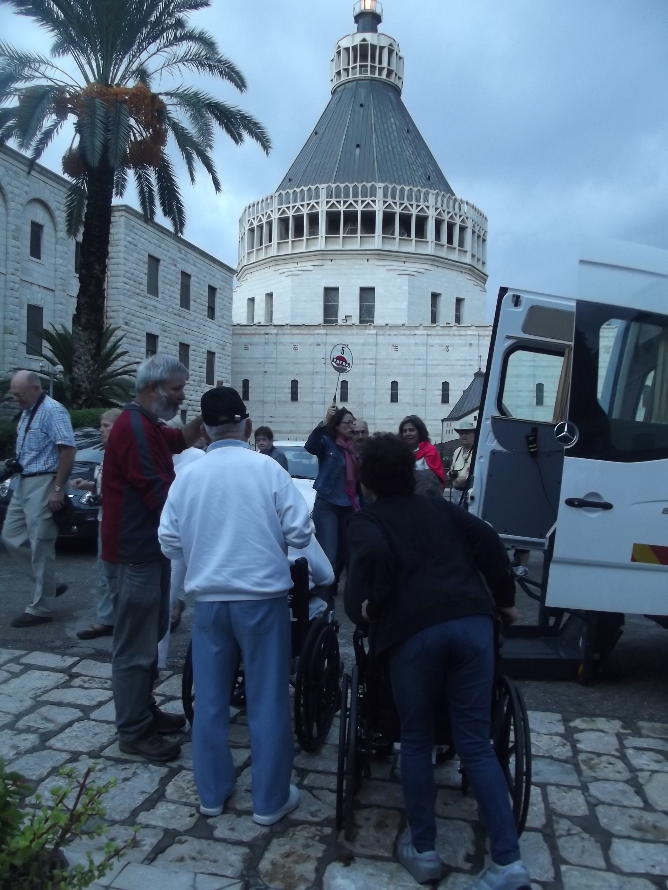 Image of visitors and wheelchair accessible transport